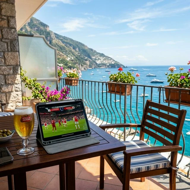 Streaming live UK football on a tablet from a sunny holiday balcony in Spain